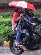 Commuters cover themselves amid heavy rainfall in New Delhi. (ANI Photo) Commuters cover themselves amid heavy rainfall in New Delhi. (ANI Photo)