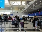 FILE PHOTO: Travellers are seen at the Delta Airlines check-in area at John F. Kennedy International Airport (JFK) in New York City, U.S., May 7, 2025.