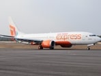 An Air India Express aircraft on a runway.
