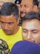 Security personnel escort Chaitanya Baghel (in yellow) after his arrest by the Enforcement Directorate on July 18. (PTI) Security personnel escort Chaitanya Baghel (in yellow) after his arrest by the Enforcement Directorate on July 18. (PTI)