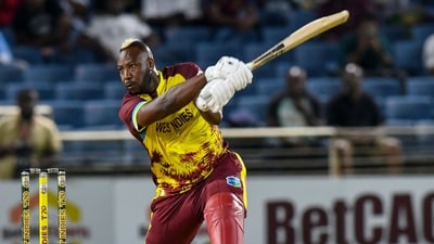 Andre Russell of West Indies hits a four during his last international match (AFP) Andre Russell of West Indies hits a four during his last international match (AFP)