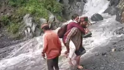 Due to the absence of a bridge on the Banni Mata Nullah in Bharmour of Chamba district, schoolchildren put their lives in danger to reach their school everyday. (HT Photo) Due to the absence of a bridge on the Banni Mata Nullah in Bharmour of Chamba district, schoolchildren put their lives in danger to reach their school everyday. (HT Photo)