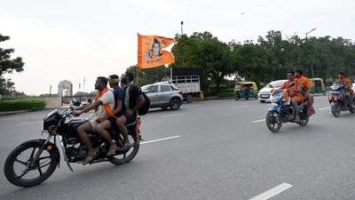 Kanwariyas were seen passing by the India Gate carrying holy water from the River Ganga were seen heading towards their hometown. (Arvind Yadav/Hindustan Times)