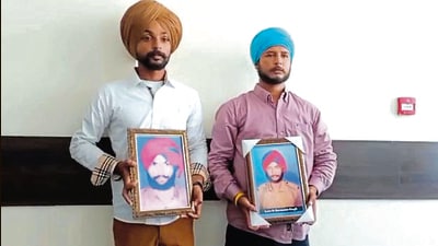 Kin show pictures of two constables killed in fake encounter by Majitha police 32 years ago. (HT Photo) Kin show pictures of two constables killed in fake encounter by Majitha police 32 years ago. (HT Photo)