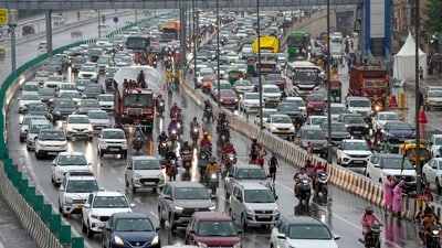 Delhi rain: Vehicles got stuck in heavy traffic during rainfall in New Delhi. (PTI) Delhi rain: Vehicles got stuck in heavy traffic during rainfall in New Delhi. (PTI)