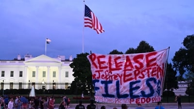 A protester holds a sign outside the White House demanding the release to all files related to Jeffrey Epstein in Washington, DC. (AFP) A protester holds a sign outside the White House demanding the release to all files related to Jeffrey Epstein in Washington, DC. (AFP)