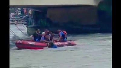 The video showed officers leaping into water from a boat to grab Hooda as the strong water currents dragged the boat. (Uttarakhand Police/ X) The video showed officers leaping into water from a boat to grab Hooda as the strong water currents dragged the boat. (Uttarakhand Police/ X)