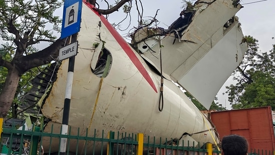 A truck carrying wreckage of the Air India plane that recently crashed into a medical hostel and its canteen complex passes by, in Ahmedabad, Gujarat. (PTI file)