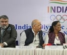Indian Olympic Association President P.T. Usha, second right, talks with Chief Executive Officer Raghuram Iyer during a joint press conference in New Delhi. (AP) Indian Olympic Association President P.T. Usha, second right, talks with Chief Executive Officer Raghuram Iyer during a joint press conference in New Delhi. (AP)