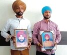 Kin show pictures of two constables killed in fake encounter by Majitha police 32 years ago. (HT Photo)