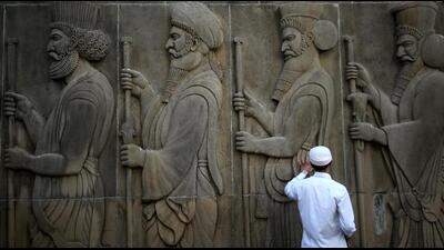 A man touches the wall of a Parsi fire temple featuring huge carvings of ancient priests on the occasion of the Persian New Year in Mumbai, India, March 21, 2019. REUTERS/Francis Mascarenhas TPX IMAGES OF THE DAY (REUTERS)