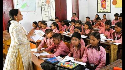 A teacher teaching students at a government-run upper primary school in Prayagraj. (HT file) A teacher teaching students at a government-run upper primary school in Prayagraj. (HT file)