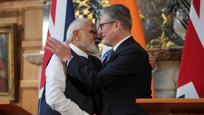 Britain's Prime Minister Keir Starmer (R) and Prime Minister Narendra Modi shake hands at the end of a joint press conference following their bilateral meeting and the signing of a Free Trade Agreement, at Chequers, in Aylesbury, England, on July 24, 2025. (AFP) Britain's Prime Minister Keir Starmer (R) and Prime Minister Narendra Modi shake hands at the end of a joint press conference following their bilateral meeting and the signing of a Free Trade Agreement, at Chequers, in Aylesbury, England, on July 24, 2025. (AFP)