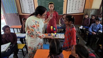 District education officer (elementary) Ravinder Kaur interacting with students in Ludhiana on Thursday. (HT Photo) District education officer (elementary) Ravinder Kaur interacting with students in Ludhiana on Thursday. (HT Photo)