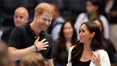 As their exclusive deal with Netflix winds down, it’s clear Harry and Meghan aren’t stepping away from the spotlight — they’re just changing how they shine in it. (Photo by Odd ANDERSEN / AFP) (AFP)