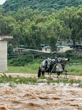 In Rajouri’s Nowshera, the army pressed into service a helicopter to rescue a minor boy from a swollen river. The Nagrota-based White Knight Corps took to X and relayed the information. (ANI) In Rajouri’s Nowshera, the army pressed into service a helicopter to rescue a minor boy from a swollen river. The Nagrota-based White Knight Corps took to X and relayed the information. (ANI)