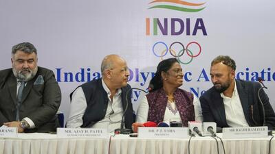 Indian Olympic Association President P.T. Usha, second right, talks with Chief Executive Officer Raghuram Iyer during a joint press conference in New Delhi. (AP) Indian Olympic Association President P.T. Usha, second right, talks with Chief Executive Officer Raghuram Iyer during a joint press conference in New Delhi. (AP)
