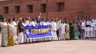 Opposition MPs protest in the Parliament complex on Thursday over the ongoing special intensive revision of electoral rolls in Bihar. (PTI) Opposition MPs protest in the Parliament complex on Thursday over the ongoing special intensive revision of electoral rolls in Bihar. (PTI)