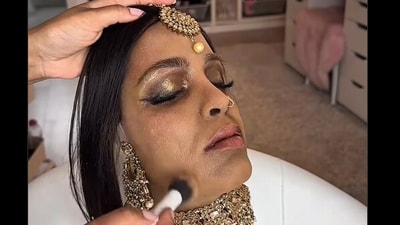 In the reel, the hyper-realistic silion face is seen styled as a Hindu bride. (Instagram/nikkissecretx) In the reel, the hyper-realistic silion face is seen styled as a Hindu bride. (Instagram/nikkissecretx)