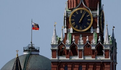 The Russian flag flies on the dome of the Kremlin Senate building behind Spasskaya Tower in Moscow (REUTERS FILE PHOTO)