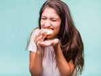 Take your time while eating, savoring each bite and chewing thoroughly. (Freepik) Take your time while eating, savoring each bite and chewing thoroughly. (Freepik)