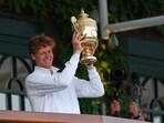 Italy's Jannik Sinner shows his Wimbledon trophy. Italy's Jannik Sinner shows his Wimbledon trophy.