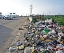 Garbage strewn around on roadsides across the city points to the long road ahead for Mohali in managing its daily waste effectively. (Sanjeev Sharma/HT)