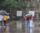 People take stroll with umbrellas during rain at The Ridge, Shimla, on Friday. (Deepak Sansta/ HT) People take stroll with umbrellas during rain at The Ridge, Shimla, on Friday. (Deepak Sansta/ HT)