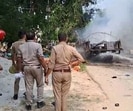 Police and fire officials at the scene of the incident in Budaun on Friday (HT Photo)