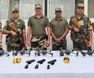The cache of arms and heroin seized by the BSF.