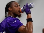 Minnesota Vikings wide receiver Justin Jefferson (18) hydrates during the team's NFL football training camp Wednesday, July 23. Minnesota Vikings wide receiver Justin Jefferson (18) hydrates during the team's NFL football training camp Wednesday, July 23.