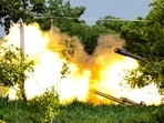 A Thai military mobile unit fires towards Cambodia's side as Thailand and Cambodia continued to exchange heavy artillery for a second day on Friday. 