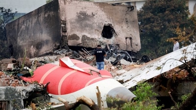 A firefighter stands next to the crashed Air India Boeing 787-8 Dreamliner aircraft, in Ahmedabad, India, June 13, 2025. (Reuters)