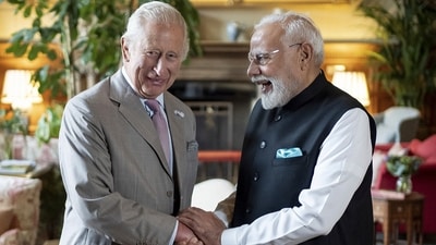 Indian Prime Minister Narendra Modi and Britain's King Charles III converse and exchange smiles during their interaction at the Sandringham Estate in Norfolk, England. (Aaron Chown/AP) Indian Prime Minister Narendra Modi and Britain's King Charles III converse and exchange smiles during their interaction at the Sandringham Estate in Norfolk, England. (Aaron Chown/AP)