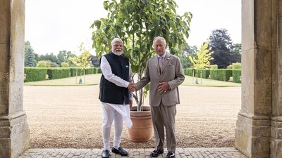 Narendra Modi and Britain's King Charles III pose with ‘Ek Ped Maa Ke Naam’, gifted by Modi to the King at the Sandringham Estate in Norfolk, England. (Aaron Chown/AP) Narendra Modi and Britain's King Charles III pose with ‘Ek Ped Maa Ke Naam’, gifted by Modi to the King at the Sandringham Estate in Norfolk, England. (Aaron Chown/AP)