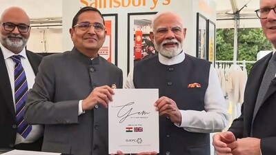 Prime Minister Narendra Modi holds the India-UK free trade agreement during a business event in the UK. (PTI) Prime Minister Narendra Modi holds the India-UK free trade agreement during a business event in the UK. (PTI)