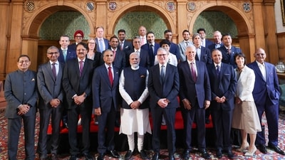 Prime Minister Narendra Modi and Prime Minister of the United Kingdom, Keir Starmer pose with business leaders from both countries after signing of the India-UK Comprehensive Economic and Trade Agreement [CETA]. (ANI)
