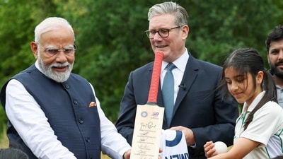 Prime Minister Narendra Modi hands a cricket bat, signed by players of the Indian cricket team, to the young cricketers of Buckinghamshire during PM Modi's visit to the UK. (ANI) Prime Minister Narendra Modi hands a cricket bat, signed by players of the Indian cricket team, to the young cricketers of Buckinghamshire during PM Modi's visit to the UK. (ANI)