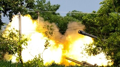 A Thai military mobile unit fires towards Cambodia's side as Thailand and Cambodia continued to exchange heavy artillery for a second day on Friday. (Reuters)