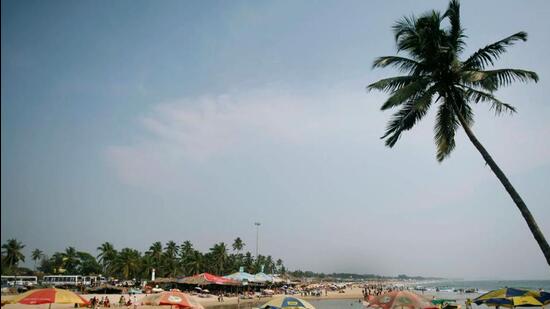 FILE PHOTO: Tourists relax at a cafe on Baga beach in Goa (REUTERS)