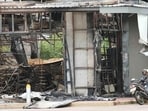 A convenience store at a gas station is damaged after Cambodia fired artillery shells in Sisaket province, Thailand.