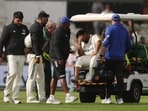 India's Rishabh Pant reacts as he is stretchered off.