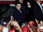 Barron Trump, now a student at NYU's Stern School, faces a unique college experience due to his father's wealth and constant Secret Service presence. (AP Photo/Marta Lavandier)