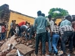 Locals during the rescue work after a government school building collapsed, in Jhalawar district, Rajasthan, on Friday. Locals during the rescue work after a government school building collapsed, in Jhalawar district, Rajasthan, on Friday.