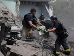 Rescuers clear the rubble after a Russian guided air bomb hit a building in Ukraine, Rescuers clear the rubble after a Russian guided air bomb hit a building in Ukraine,