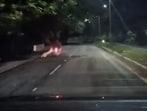 A biker and pillion rider had a narrow escape when a leopard leapt at their vehicle. A biker and pillion rider had a narrow escape when a leopard leapt at their vehicle.