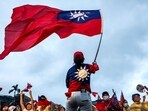 A supporter of Taiwan's main opposition party, Kuomintang (KMT), waves the country's national flag during a rally against the recall election in front of the Presidential Office in Taipei A supporter of Taiwan's main opposition party, Kuomintang (KMT), waves the country's national flag during a rally against the recall election in front of the Presidential Office in Taipei