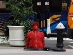 Trump, dressed in a suit and tie, was depicted in the statue staring up with his lips pursed and his face serious. Trump, dressed in a suit and tie, was depicted in the statue staring up with his lips pursed and his face serious.