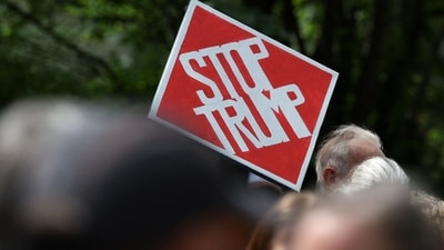 Demonstrators raised anti-Trump slogans near the US Consulate building in Edinburgh, Scotland on July 26, 2025. US President Donald Trump landed in Scotland on July 25, for a five-day visit set to mix diplomacy, business and leisure. (Photo by SCOTT HEPPELL / AFP) (AFP) Demonstrators raised anti-Trump slogans near the US Consulate building in Edinburgh, Scotland on July 26, 2025. US President Donald Trump landed in Scotland on July 25, for a five-day visit set to mix diplomacy, business and leisure. (Photo by SCOTT HEPPELL / AFP) (AFP)