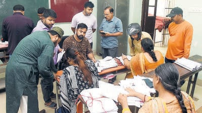 Booth Level Officers verify documents during the SIR in Patna. (HT File) Booth Level Officers verify documents during the SIR in Patna. (HT File)